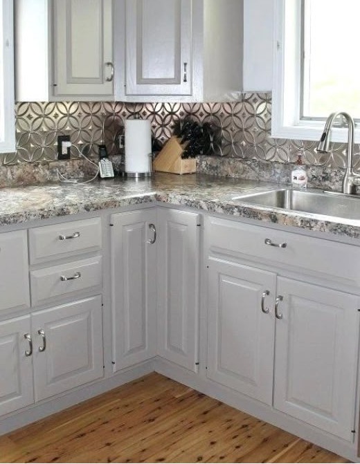 Kitchen after refinishing to warm white