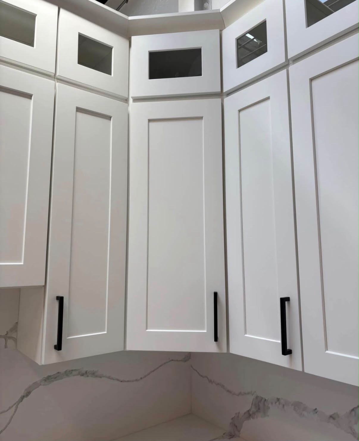 White shaker cabinets with matte black hardware