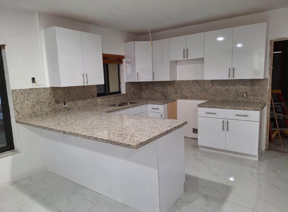 Refinished white kitchen with granite countertops