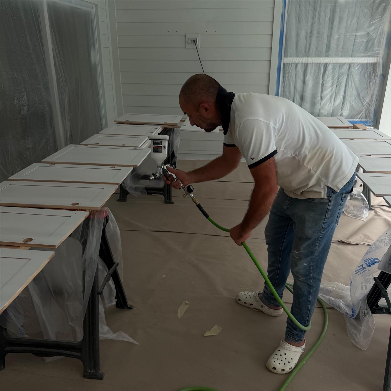 Spraying cabinet doors on site